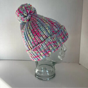 Rainbow Sunset colored hand knit hat. 100 percent acrylic .